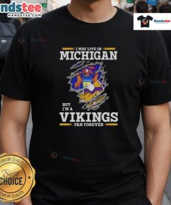Premium I May Live In Michigan But I'm A Minnesota Vikings Fan Forever T-Shirt, showcasing team spirit and loyalty.