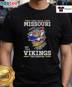 Premium I May Live In Missouri But I'm A Minnesota Vikings Fan Forever T-Shirt featuring bold team colors and graphics.