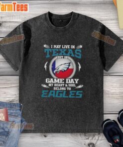 Premium washed t-shirt featuring 'I May Live In Texas, But My Heart Belongs To Philadelphia Eagles' design.