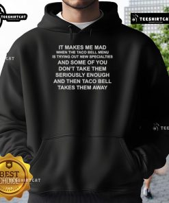Premium hoodie featuring 'It Makes Me Mad When The Taco Bell Menu Tries Out New Specialties' design for taco lovers.