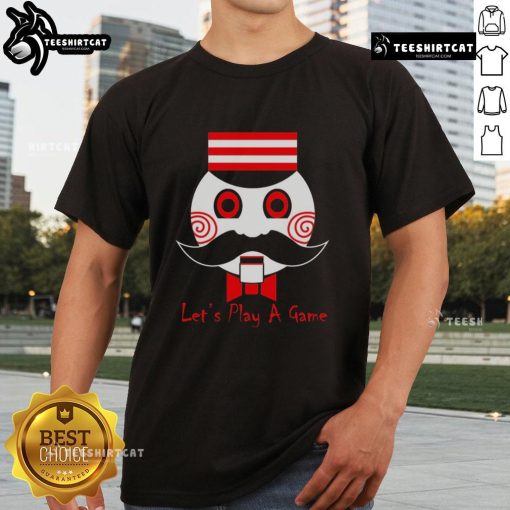 Premium Lets Play A Game Saw Movie T-Shirt featuring horror-themed design and bold graphics for fans.