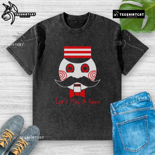 Premium Let's Play a Game Saw Movie washed t-shirt featuring a graphic design inspired by the iconic horror film.