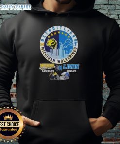 Premium Michigan Wolverines hoodie featuring helmets and Detroit Lions skyline, perfect for game days and fan style.