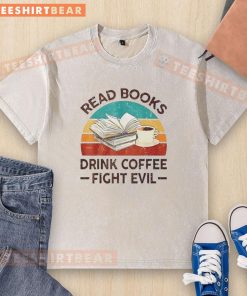 Vintage washed t-shirt featuring 'Read Books, Drink Coffee, Fight Evil' design, perfect for book lovers and coffee enthusiasts.