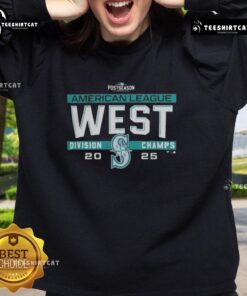 Alt Text: Premium Seattle Mariners MLB 2025 AL West Division Title postseason sweatshirt displayed in a locker room setting.