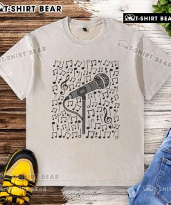 Alt Text: Premium singer microphone and musical notes design on a washed t-shirt for singing teachers and musicians.