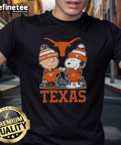 Alt Text: Premium Snoopy and Charlie Brown Texas Longhorns football skyline t-shirt featuring iconic characters in vibrant colors.