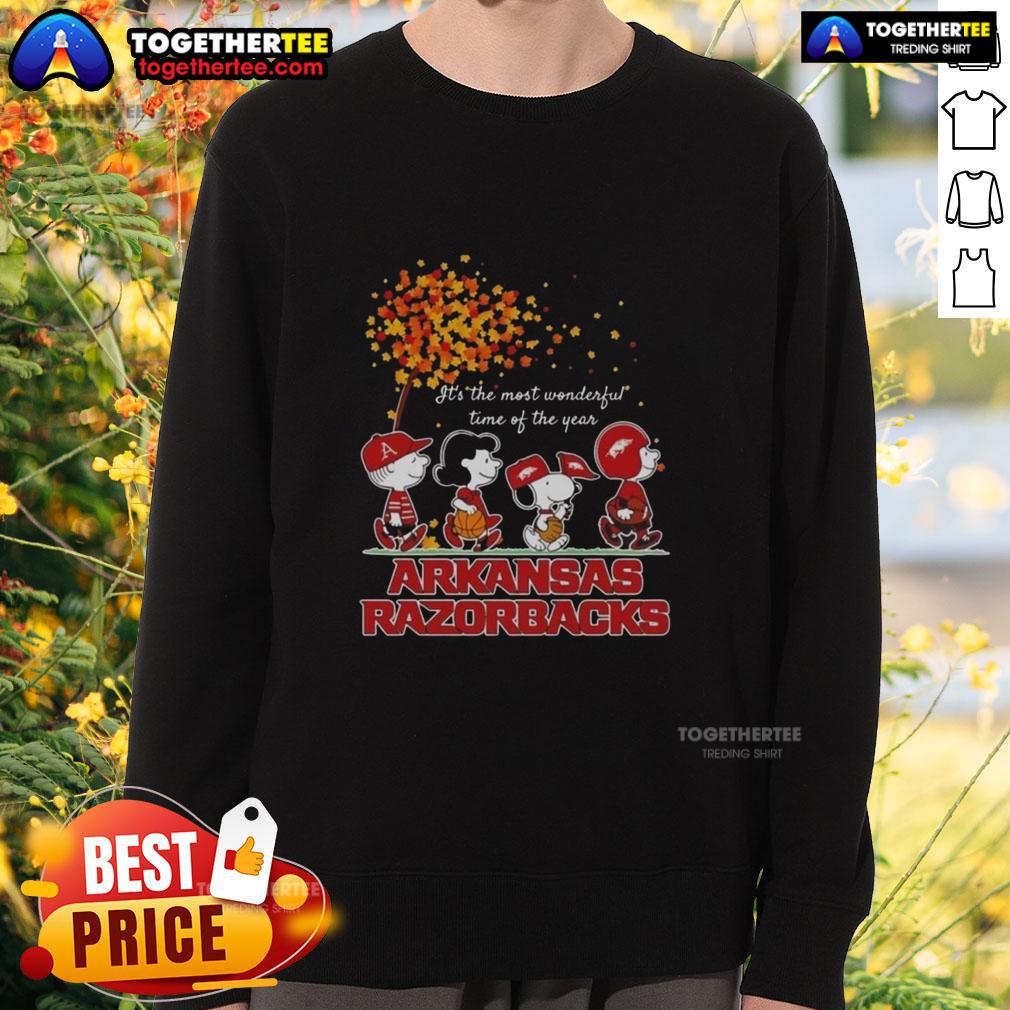 Premium Snoopy And Friends Arkansas Razorbacks It's The Most Wonderful Time Of The Year Autumn Sweatshirt Alt Text: Premium Snoopy and Friends Arkansas Razorbacks sweatshirt for autumn, featuring a festive design perfect for the season.