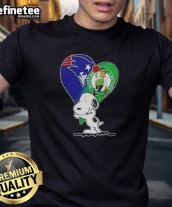 Alt Text: Premium Snoopy Hug Heart T-Shirt featuring New England Patriots and Boston Celtics logos, perfect for sports fans.