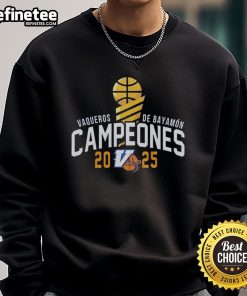 Premium Vaqueros de Bayamn Champions 2025 sweatshirt for Baloncesto Superior Nacional fans, featuring team logo.