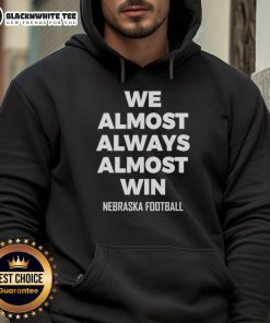 Premium Nebraska football hoodie featuring 'We Almost Always Win' design, perfect for fans and game day wear.