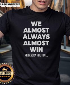 Premium We Almost Always Almost Win Nebraska Football T-Shirt featuring bold graphics and comfortable fit for fans.
