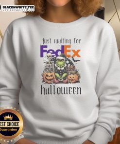 Alt Text: Pretty Grinch waiting for FedEx in a festive Halloween sweatshirt, perfect for holiday celebrations.