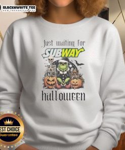 Alt Text: Pretty Grinch Halloween sweatshirt design featuring the Grinch waiting for the subway, perfect for festive attire.