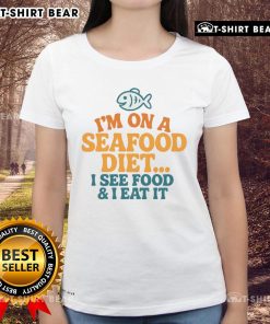 Funny ladies tee featuring 'I'm on a seafood diet: I see food, I eat it' slogan, perfect for seafood lovers.