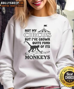 Cozy sweatshirt featuring the phrase 'Not My Circus, But I've Grown Quite Fond of Its Monkeys' in stylish font.