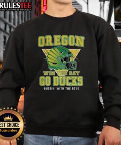 Alt Text: Pretty Oregon Win The Day Go Ducks sweatshirts featuring vibrant team colors and helmet designs for fans.