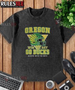 Alt Text: Pretty Oregon Win the Day Go Ducks helmets on a washed t-shirt, showcasing team spirit and style.