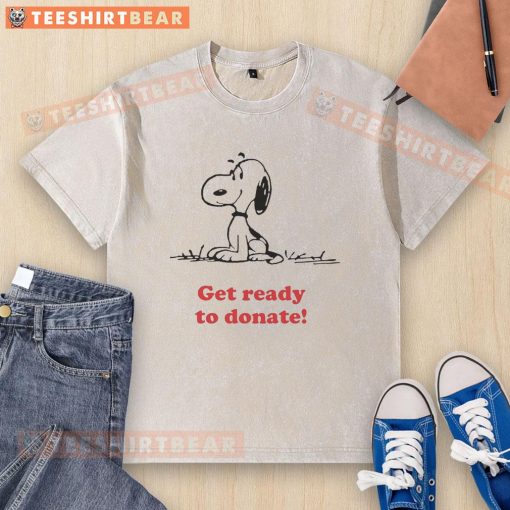 Alt Text: Pretty Peanuts x American Red Cross T-shirt ready for donation, featuring vibrant graphics and a washed design.