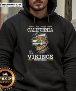 California fan wearing a Minnesota Vikings hoodie, showcasing team pride with style and comfort.
