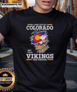 Alt Text: Pretty Premium I May Live In Colorado But I'M A Minnesota Vikings Fan Forever T-Shirt with bold graphic design.