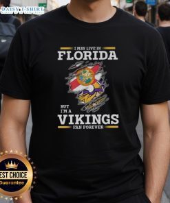 Pretty Premium I May Live In Florida But I'M A Minnesota Vikings Fan Forever T-Shirt featuring vibrant team colors and logo.