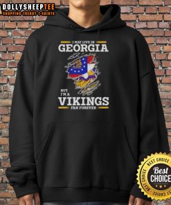 Alt Text: Cozy hoodie featuring I May Live In Georgia But I'm A Minnesota Vikings Fan Forever design, perfect for fans.