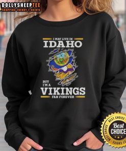 Alt Text: Cozy sweatshirt featuring I May Live In Idaho But I'm A Minnesota Vikings Fan Forever for dedicated fans.