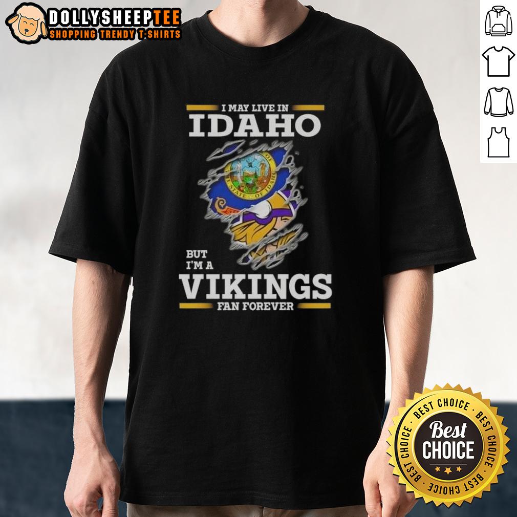Pretty Premium I May Live In Idaho But I'm A Minnesota Vikings Fan Forever T-Shirt Alt Text: Pretty Premium I May Live In Idaho But I'm A Minnesota Vikings Fan Forever T-Shirt design featuring team colors.