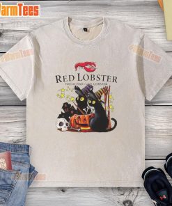 Pretty red lobster design on a black cat witch pumpkin Halloween washed t-shirt, perfect for festive celebrations.