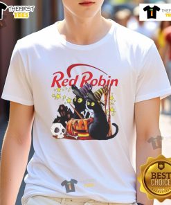 Pretty red robin and black cat witch with pumpkin near a haunted house on a Halloween T-shirt design.