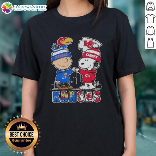 Pretty Snoopy and Charlie Brown Kansas City Sports tee featuring Jayhawks and Chiefs skyline design for ladies.