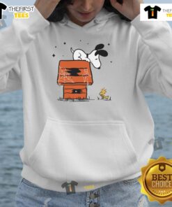 Pretty Snoopy and Woodstock in a haunted doghouse hoodie, perfect for Halloween pet lovers and Peanuts fans.