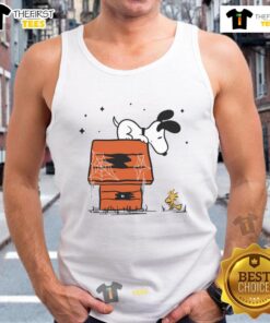 Pretty Snoopy and Woodstock in a haunted doghouse design on a stylish tank top, perfect for Halloween enthusiasts.