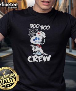Alt Text: Pretty Snoopy the Peanuts x Boo Boo Crew nurse ghost Halloween cartoon t-shirt design featuring playful spooky elements.