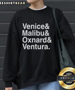 Cozy 'Pretty Venice Malibu Oxnard and Ventura' sweatshirt displayed on a wooden background, perfect for casual wear.