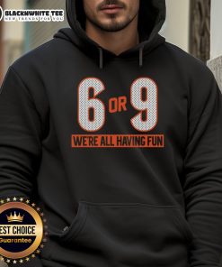Group of friends wearing 'Top 6 or 9 We're All Having Fun' hoodies, enjoying a vibrant outdoor gathering.