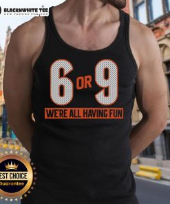 Group of friends wearing 'Top 6 or 9 We're All Having Fun' tank tops, enjoying a sunny outdoor party together.