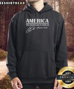 Charlie Kirk wearing a 'Top America: The Golden Age Is Upon Us' hoodie, promoting patriotic themes and optimism.