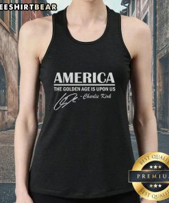 Charlie Kirk wearing a tank top with 'Top America: The Golden Age Is Upon Us' slogan, promoting American ideals.