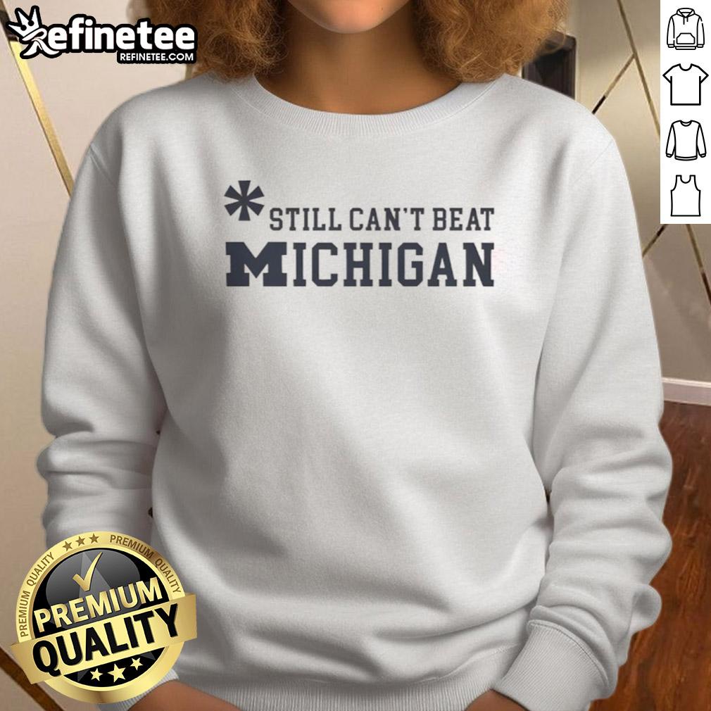 Top Asterisk Still Can'T Beat Michigan Wolverines Sweatshirt Top Asterisk Still Can't Beat Michigan Wolverines Sweatshirt featuring team colors and logo, perfect for fans.