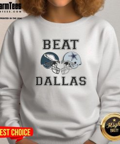 Top Coach Nick Sirianni wearing a Dallas Beat sweatshirt, showcasing team spirit and style during a football event.