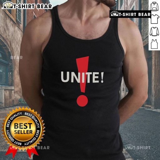 Dominic Fike wearing a stylish Unite tank top, showcasing his unique fashion sense and vibrant style.