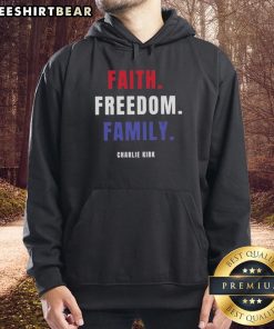 Charlie Kirk wearing a 'Top Faith Freedom Family' hoodie, promoting values of faith, freedom, and family unity.