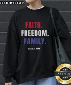 Charlie Kirk sweatshirt featuring 'Top Faith Freedom Family' design, perfect for supporters of conservative values.