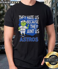 Top Houston Astros Grinch Christmas T-Shirt featuring 'They Hate Us Ain't Us' design, perfect for holiday cheer.