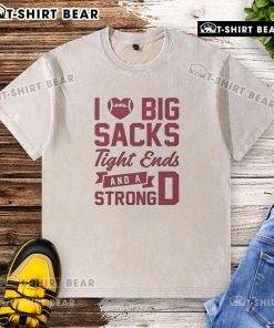 Alt Text: Casual washed t-shirt featuring 'I Love Big Sacks, Tight Ends, and a Strong D' graphic design for sports fans.