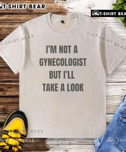 Classic washed t-shirt featuring humorous phrase I'm Not A Gynecologist But I'll Take A Look for casual wear.