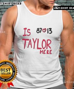 Taylor Swift wearing a Travis Kelce Chiefs 87 love tank top, showcasing her support for the NFL star.