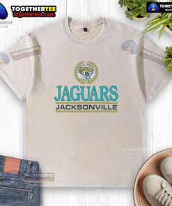 Alt Text: Top Jacksonville Jaguars crest washed t-shirt featuring team colors and logo, perfect for fans and casual wear.